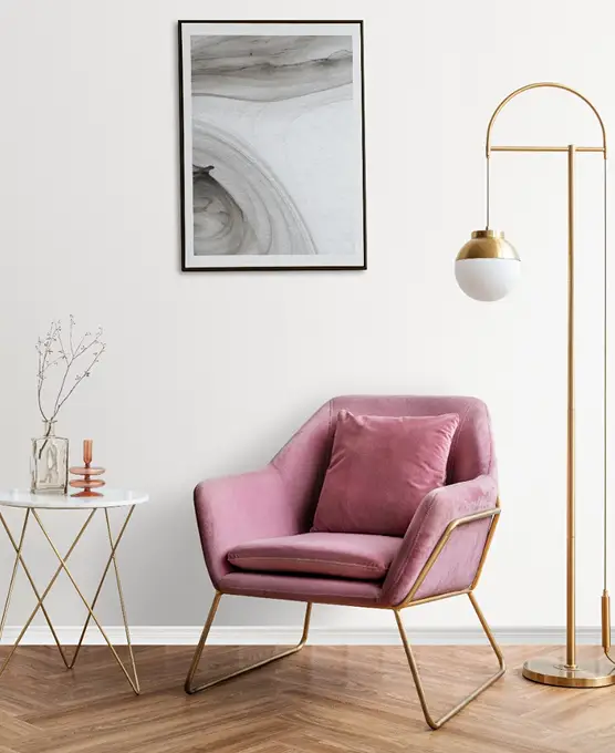 Modern living room with pink velvet chair.